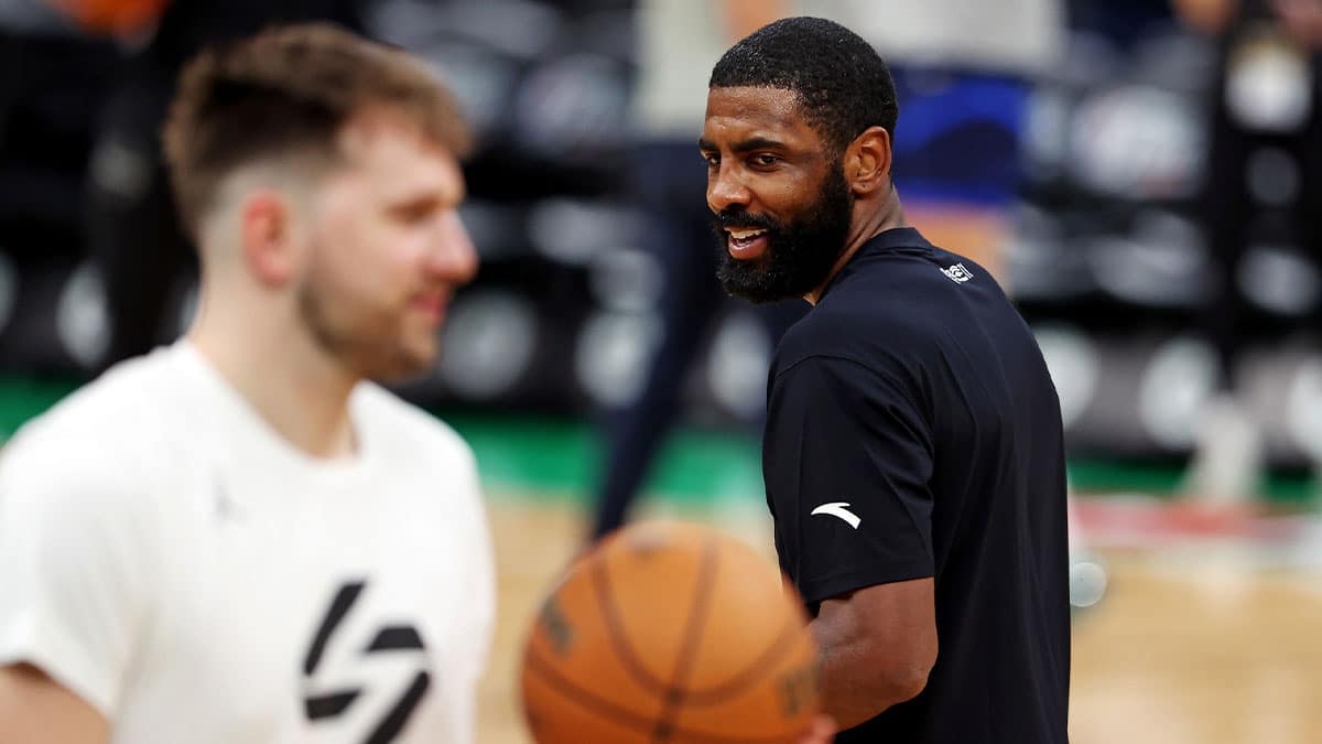 Jun 5, 2024; Boston, MA, USA; Dallas Mavericks guard Kyrie Irving (11) laughs with guard Luka Doncic (77) during the NBA Finals Media Day at TD Garden. Mandatory Credit: Peter Casey-USA TODAY Sports