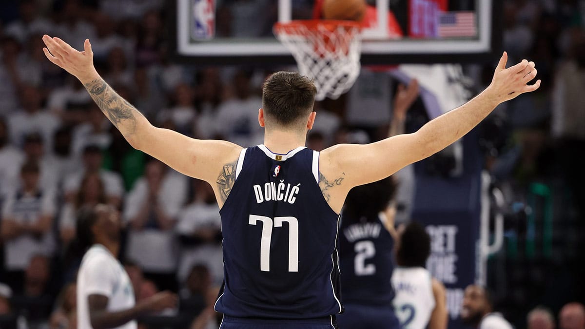 Dallas Mavericks guard Luka Doncic (77) celebrates in the fourth quarter against the Minnesota Timberwolves in game one of the western conference finals for the 2024 NBA playoffs at Target Center.