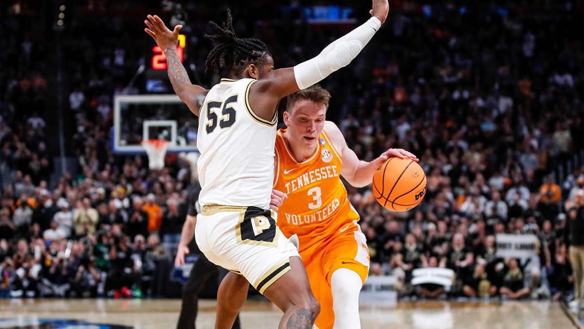 Tennessee guard Dalton Knecht (3) dribbles against Purdue guard Lance Jones (55) during the second half of the NCAA tournament Midwest Regional Elite 8 round at Little Caesars Arena in Detroit on Sunday, March 31, 2024.