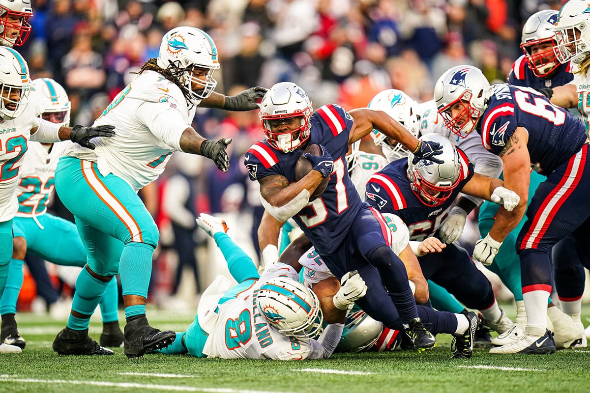 New England Patriots running back Damien Harris (37) runs the ball against the Miami Dolphins in the second half at Gillette Stadium. 