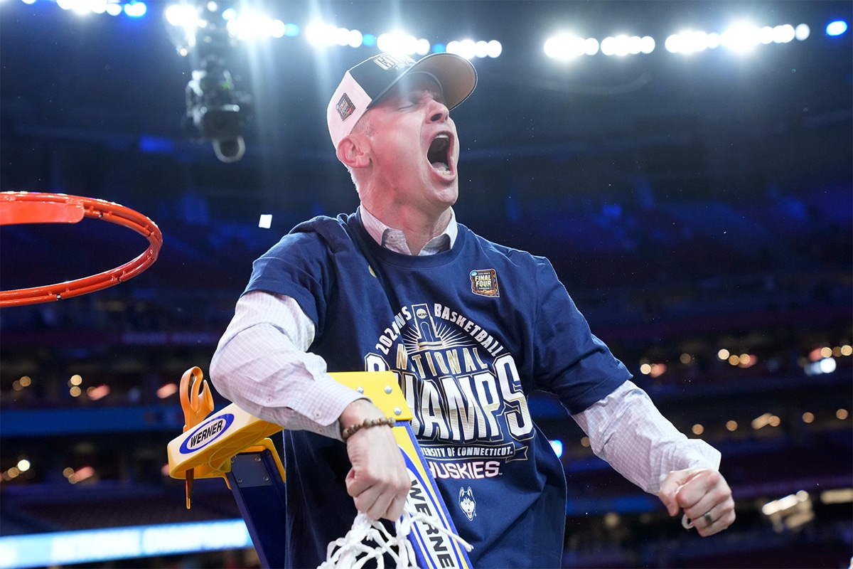 Connecticut Huskies head coach Dan Hurley cuts down the cut after defeating the Purdue Boilermakers in the national championship game of the Final Four of the 2024 NCAA Tournament at State Farm Stadium in Glendale on April 8, 2024