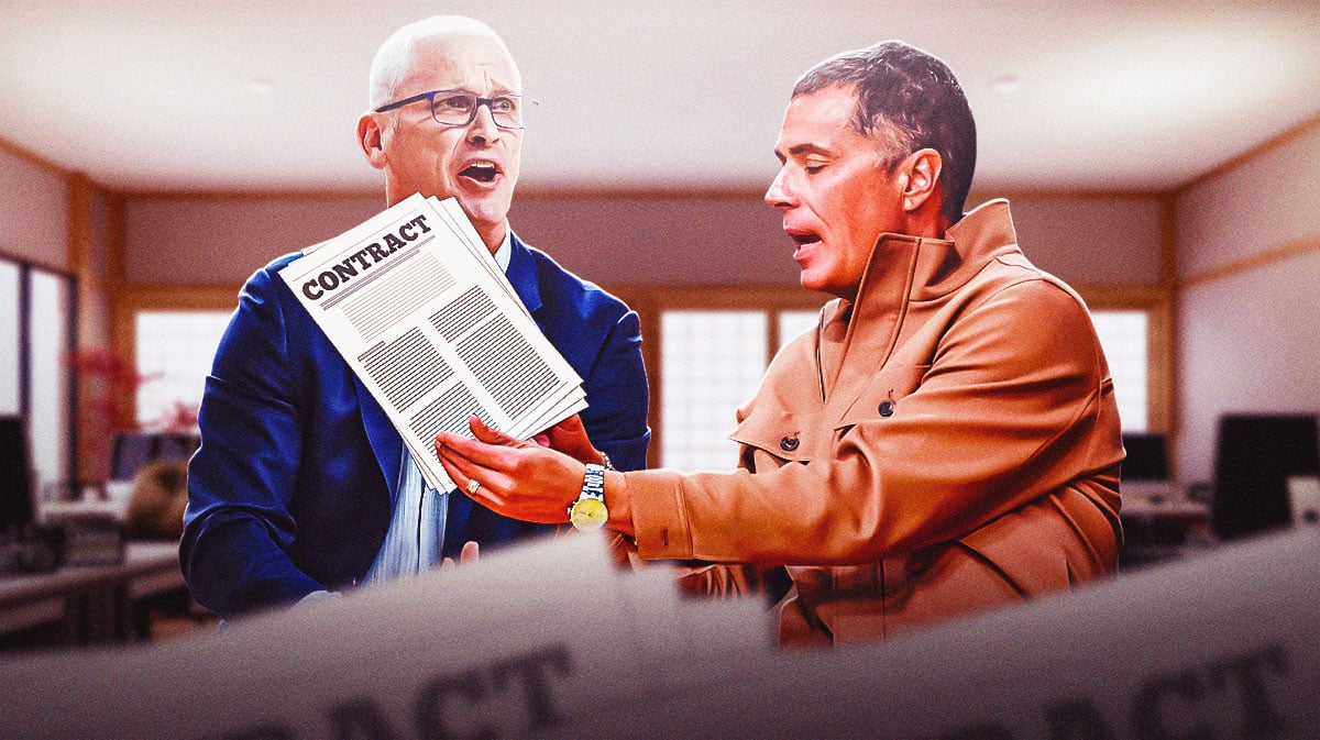 Lakers' Rob Pelinka with a contract for Dan Hurley.