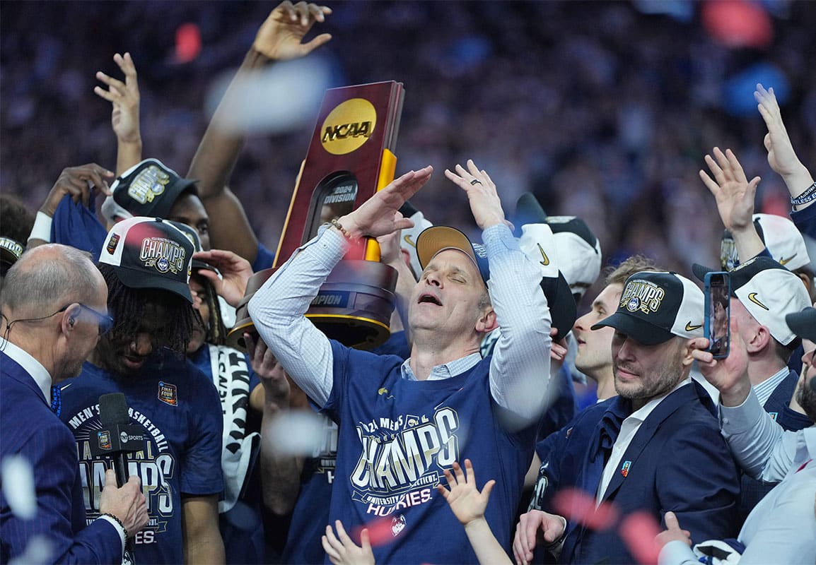 Connecticut Huskies head coach Dan Hurley celebrates after winning the national championship game of the Final Four of the 2024 NCAA Tournament against the Purdue Boilermakers at State Farm Stadium.