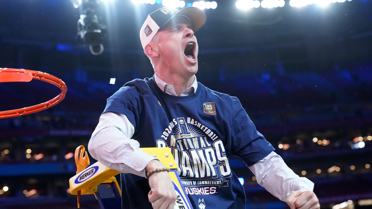 Connecticut Huskies head coach Dan Hurley cuts down the cut after defeating the Purdue Boilermakers in the national championship game of the Final Four of the 2024 NCAA Tournament at State Farm Stadium in Glendale on April 8, 2024.