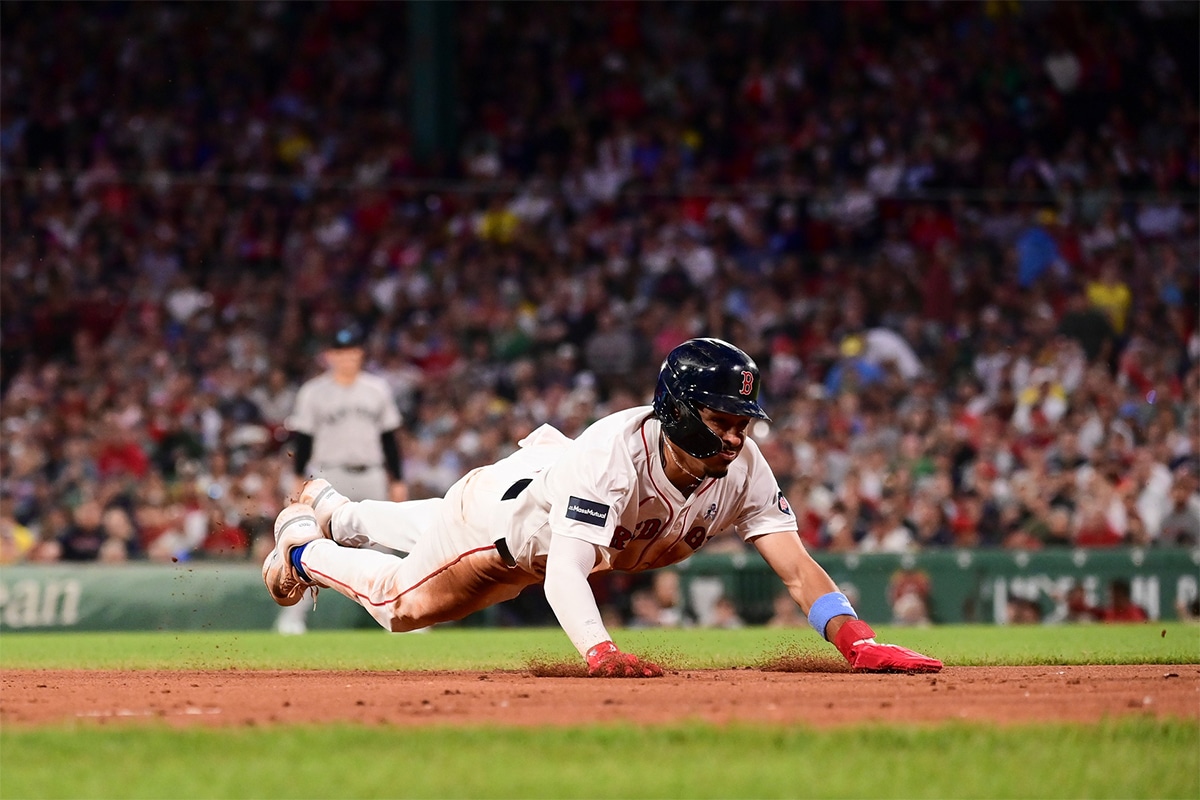 Boston Red Sox shortstop David Hamilton (70) steals third base against the New York Yankees during the fifth inning at Fenway Park.