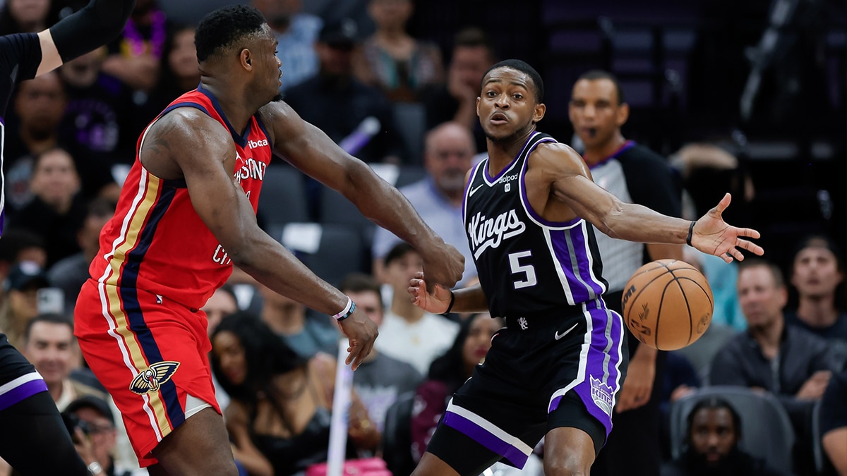 Sacramento Kings guard De'Aaron Fox (5) breaks up a pass by New Orleans Pelicans forward Zion Williamson (1) during the second quarter at Golden 1 Center.