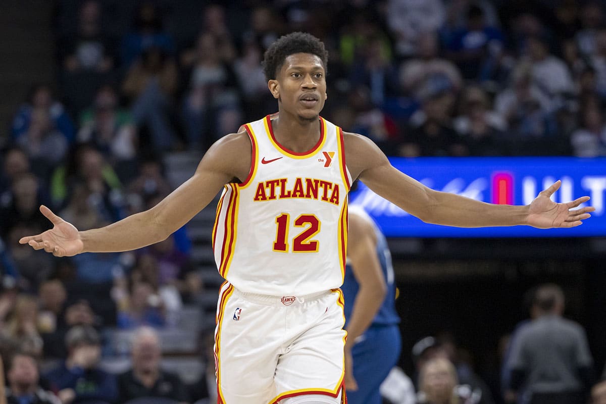 Atlanta Hawks forward De'Andre Hunter (12) reacts after making a three point shot in the second half against the Minnesota Timberwolves at Target Center.