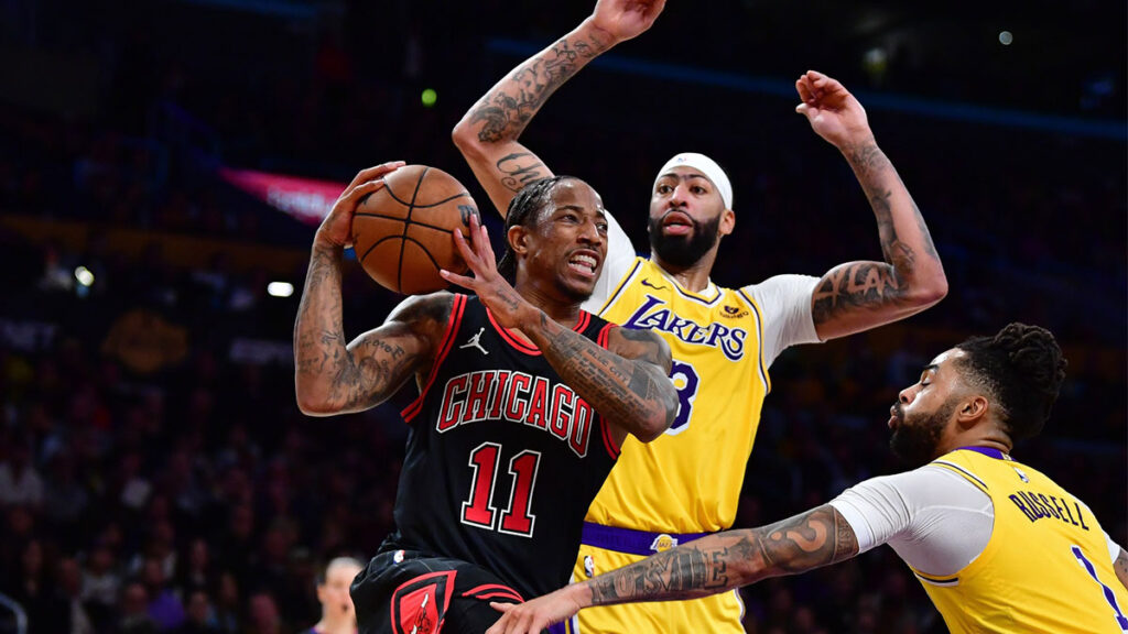 Chicago Bulls forward DeMar DeRozan (11) moves the ball against Los Angeles Lakers forward Anthony Davis (3) and guard D'Angelo Russell (1) during the second half at Crypto.com Arena. 