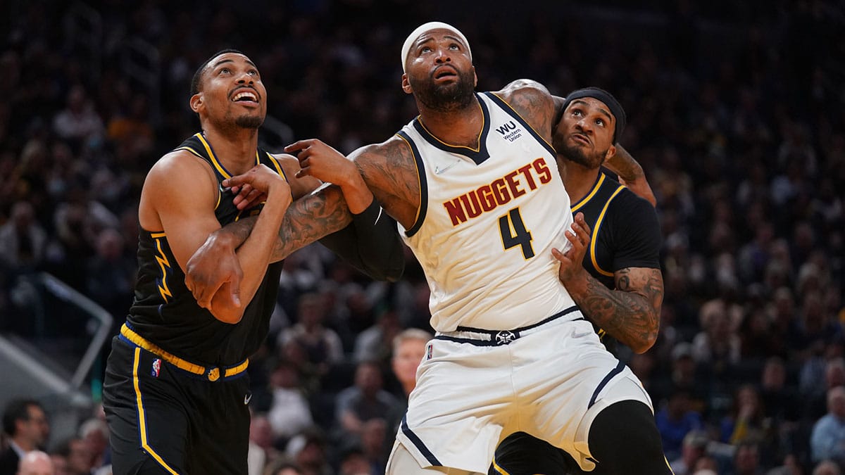 Denver Nuggets center DeMarcus Cousins (4) battles for position with Golden State Warriors forward Otto Porter Jr. (32) and guard Gary Payton II (0) in the fourth quarter during game five of the first round for the 2022 NBA playoffs at Chase Center.