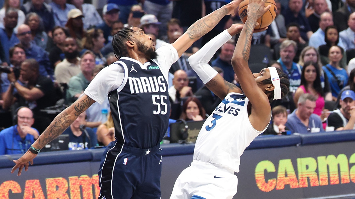 Dallas Mavericks forward Derrick Jones Jr. (55) blocks Minnesota Timberwolves forward Jaden McDaniels (3) during the second quarter of game four of the western conference finals for the 2024 NBA playoffs at American Airlines Center.
