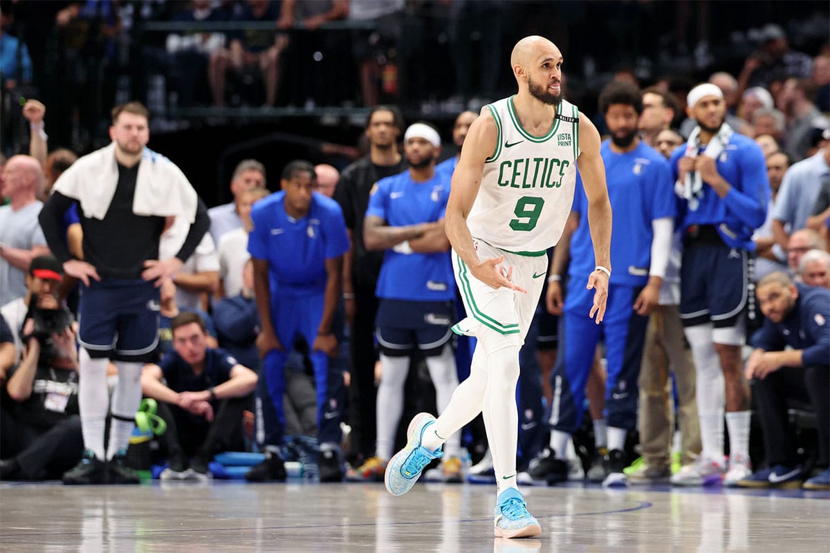 Boston Celtics guard Derrick White (9) reacts after making a three point basket against the Dallas Mavericks during the fourth quarter during game three of the 2024 NBA Finals at American Airlines Center.