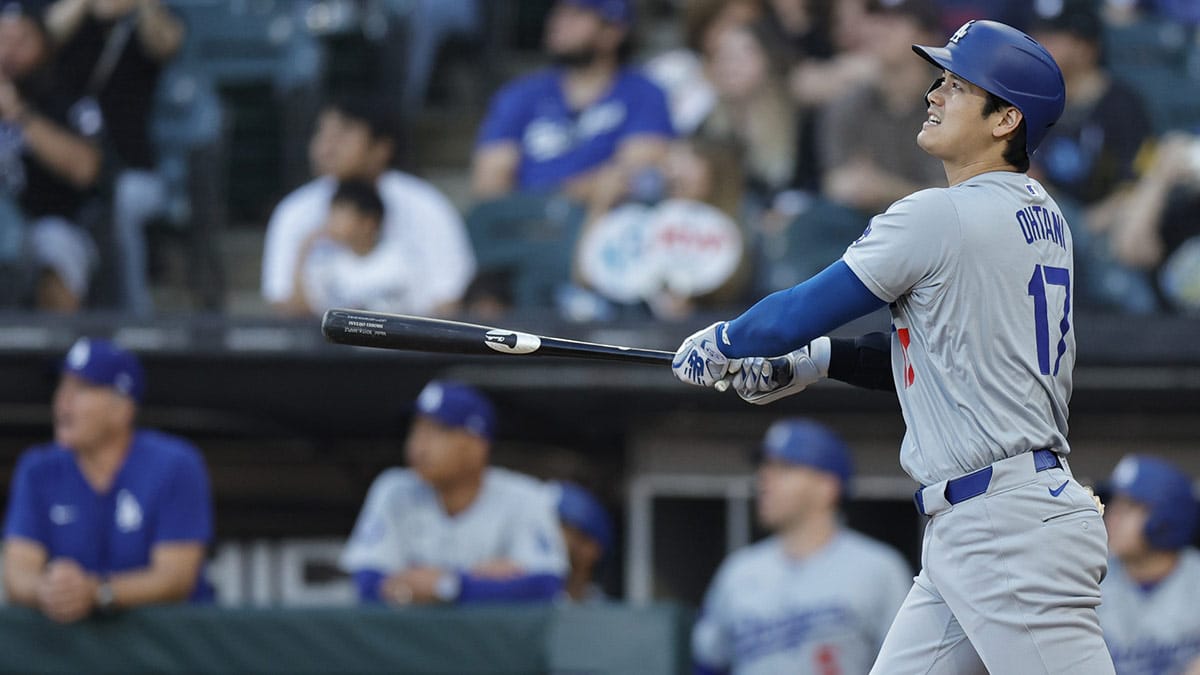 Los Angeles Dodgers designated hitter Shohei Ohtani (17) watches his solo home run against the Chicago White Sox during the first inning at Guaranteed Rate Field.