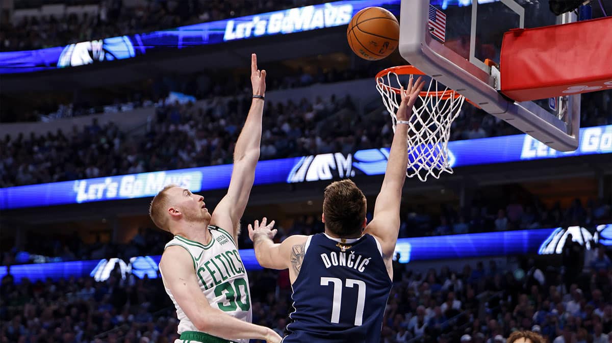  Dallas Mavericks guard Luka Doncic (77) shoots the ball against Boston Celtics forward Sam Hauser (30) during the third quarter during game four of the 2024 NBA Finals at American Airlines Center.
