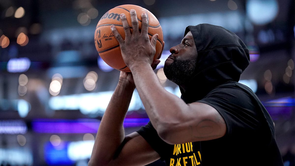 Golden State Warriors forward Draymond Green (23) shoots before a game against the Sacramento Kings in a play-in game of the 2024 NBA playoffs at the Golden 1 Center.