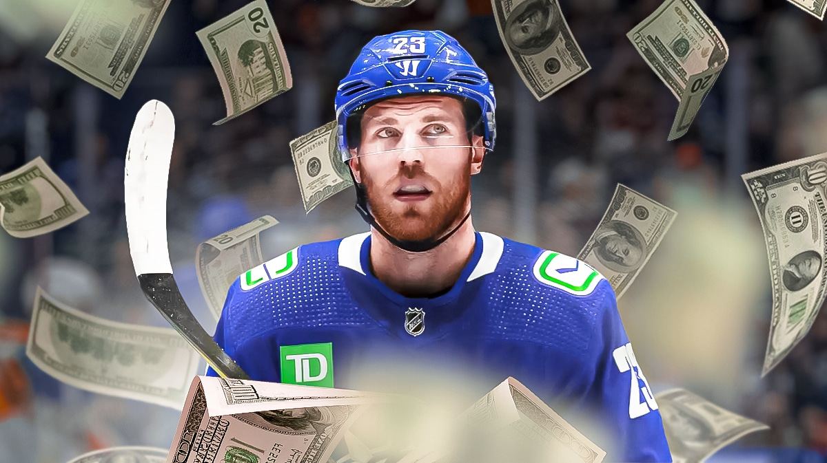 Elias Lindholm in a Canucks uniform. Money flying around