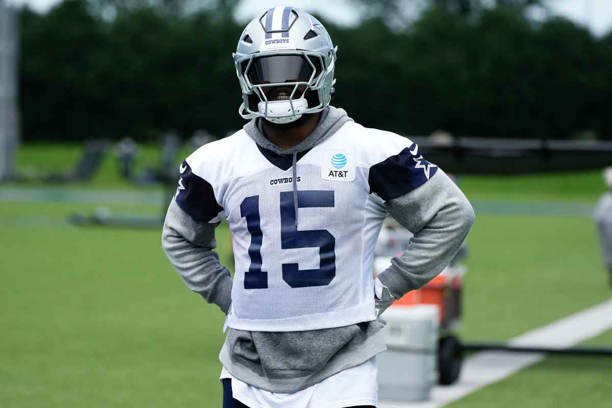 Jun 5, 2024; Frisco, TX, USA; Dallas Cowboys running back Ezekiel Elliott (15) goes through a drill during practice at the Ford Center at the Star Training Facility in Frisco, Texas.