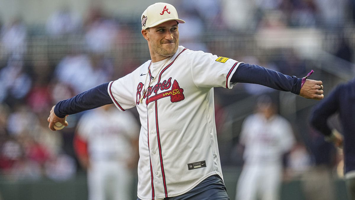 Atlanta Falcons quarterback Kirk Cousins throws out the first pitch prior to the game between the Atlanta Braves against the Texas Rangers at Truist Park.