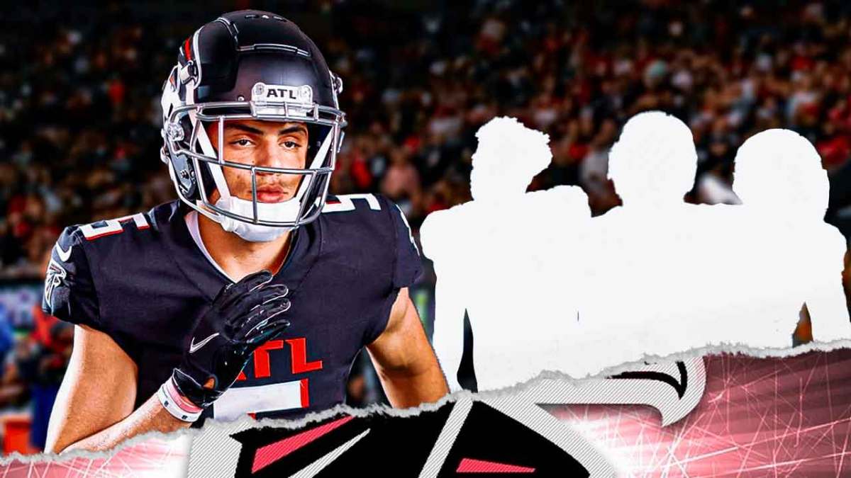 Drake London in the middle, 3 mystery players around him, Atlanta Falcons wallpaper in the background