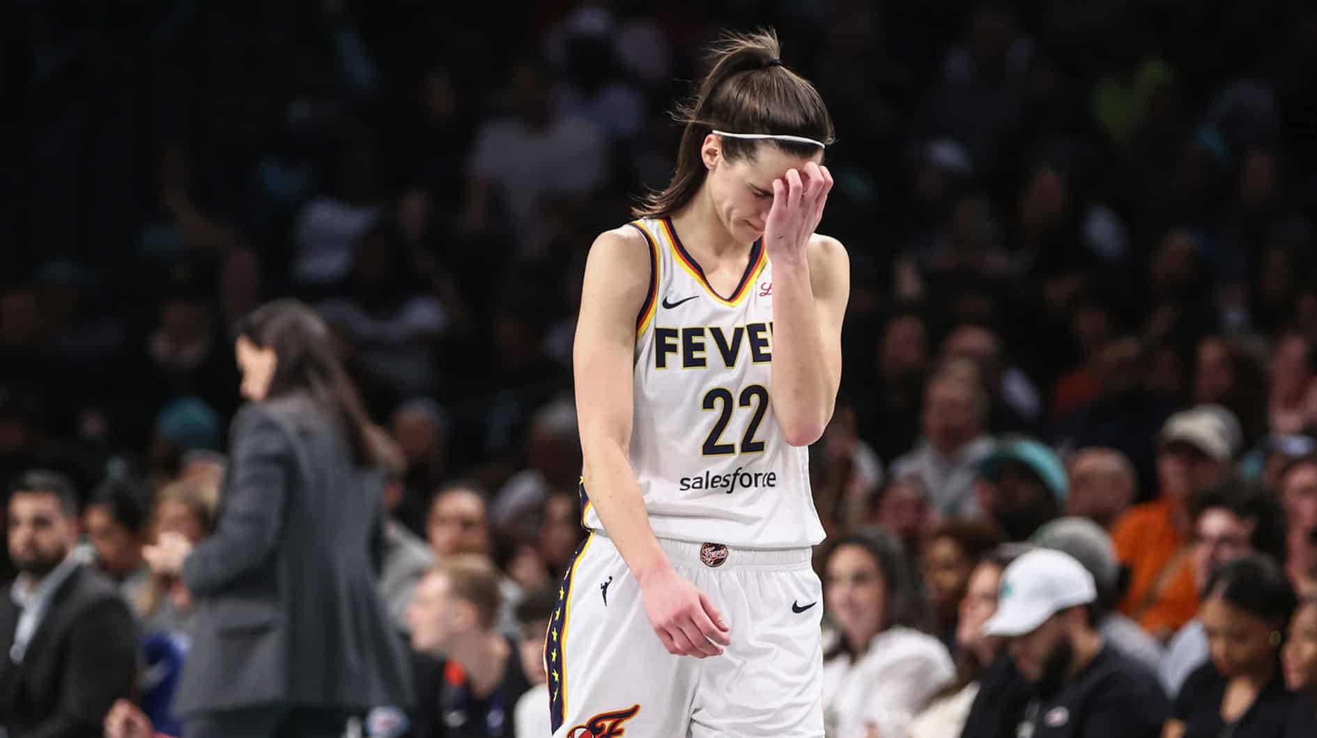 ndiana Fever guard Caitlin Clark (22) walks back to the bench in the third quarter against the New York Liberty at Barclays Center.