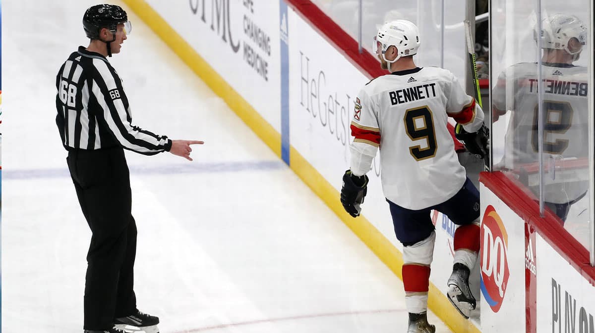 NHL linesman CJ Murray (68) directs Florida Panthers center Sam Bennett (9) into the penalty box against the Pittsburgh Penguins during the third period at PPG Paints Arena. Florida won 3-2 in a shootout