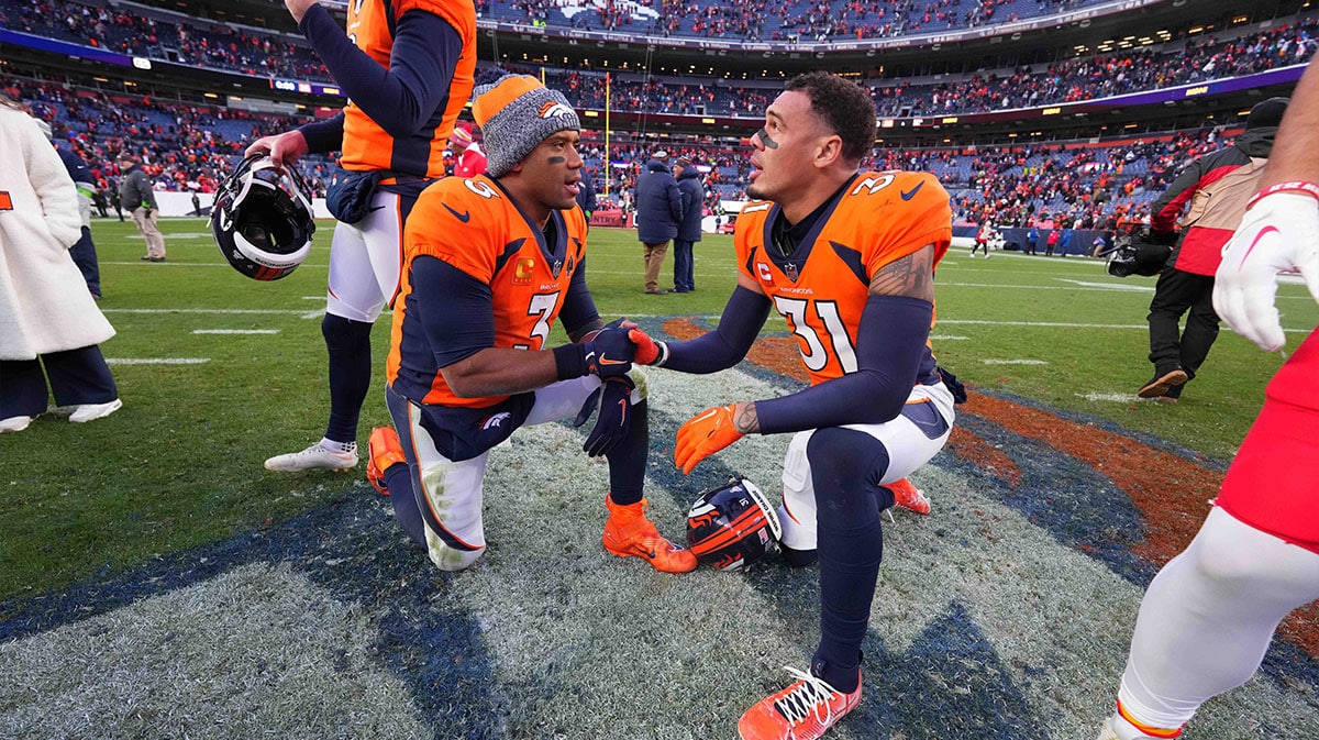 Denver Broncos quarterback Russell Wilson (3) and safety Justin Simmons (31) the win over the Kansas City Chiefs at Empower Field at Mile High.