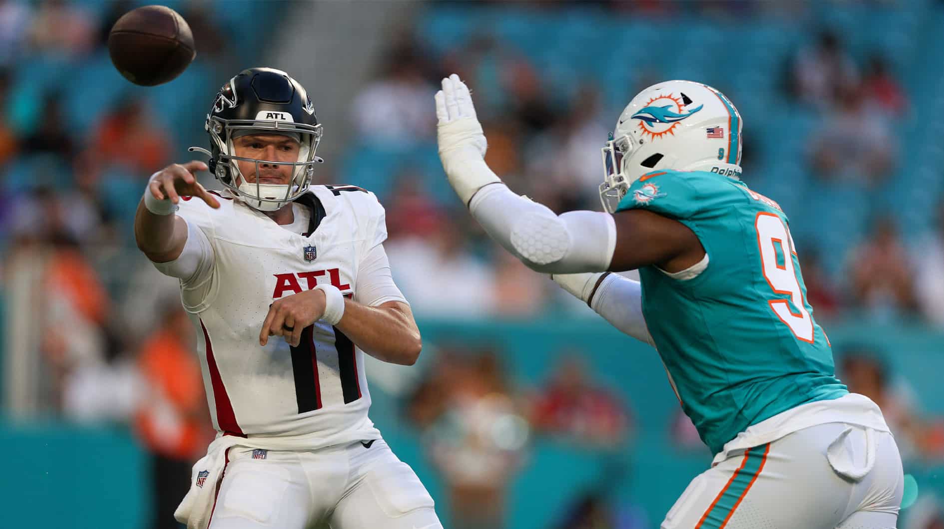 Atlanta Falcons quarterback Logan Woodside (11) is pressured by Miami Dolphins defensive end Emmanuel Ogbah (91) in the first quarter at Hard Rock Stadium. 