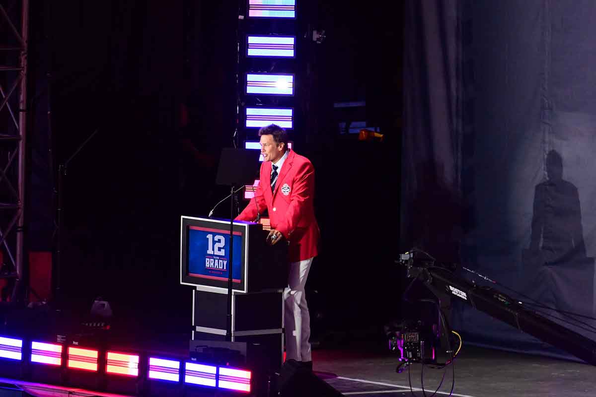 Jun 12, 2024; Foxborough, MA, USA; Former quarterback Tom Brady speaks during his New England Patriots Hall of Fame induction ceremony at Gillette Stadium. Mandatory Credit: Eric Canha-USA TODAY Sports