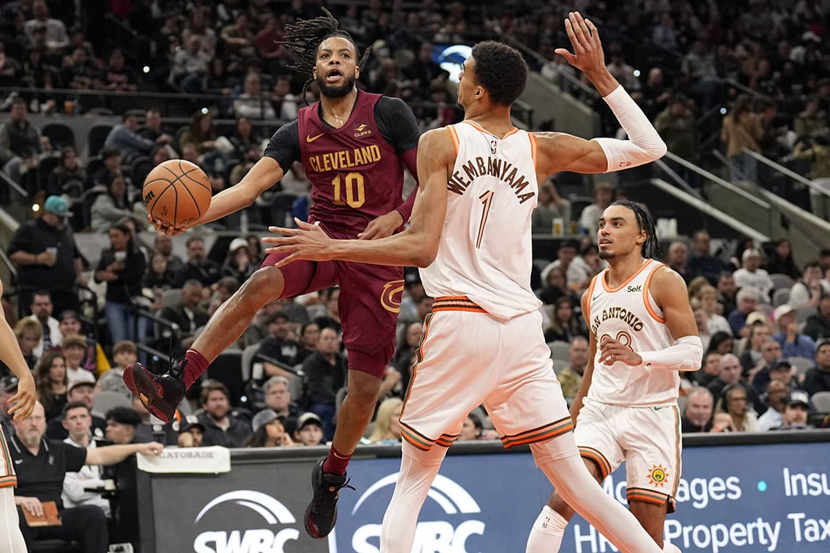 Cleveland Cavaliers guard Darius Garland (10) passes the ball around San Antonio Spurs forward Victor Wembanyama (1) during the second half at Frost Bank Center.