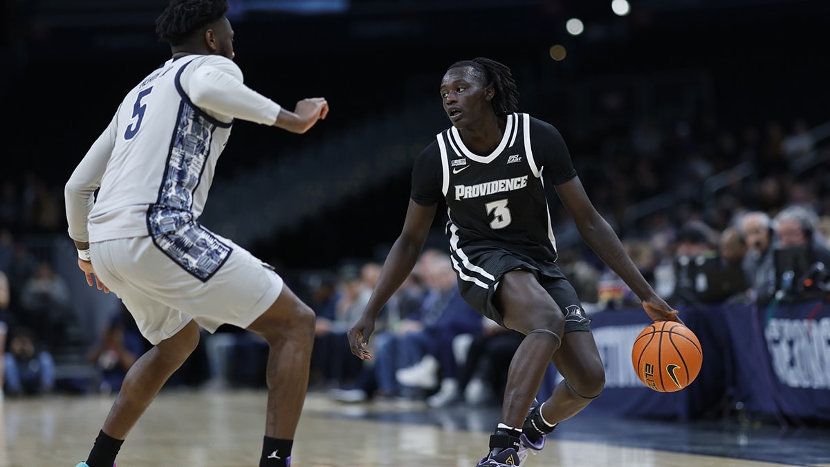 Providence Friars guard Garwey Dual (3) dribbles the ball as Georgetown Hoyas guard Jay Heath (5) defends in the first half at Capital One Arena. 