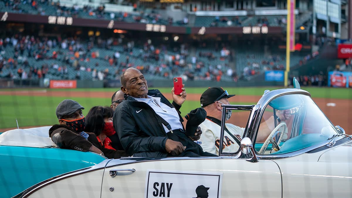 San Francisco Giants retired center fielded Willie Mays (24) celebrates his 90th birthday with fans at Oracle Park before the start of the game against the San Diego Padres. 