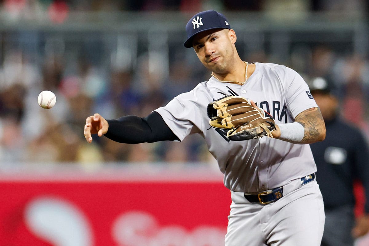 New York Yankees second baseman Gleyber Torres (25) makes the throw to first for an out in the fifth inning against the San Diego Padres at Petco Park.
