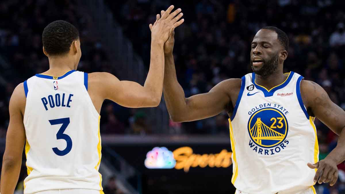 Jan 22, 2023; San Francisco, California, USA; Golden State Warriors guard Jordan Poole (3) and forward Draymond Green (23) celebrate after Poole drew a foul against the Brooklyn Nets during the first half at Chase Center. Mandatory Credit: John Hefti-USA TODAY Sports