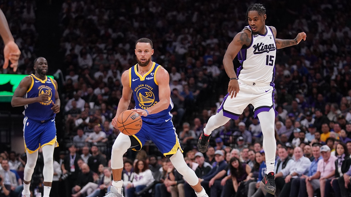 Apr 16, 2024; Sacramento, California, USA; Golden State Warriors guard Stephen Curry (30) dribbles the ball in front of Sacramento Kings guard Davion Mitchell (15) in the fourth quarter during a play-in game of the 2024 NBA playoffs at the Golden 1 Center. Mandatory Credit: Cary Edmondson-USA TODAY Sports