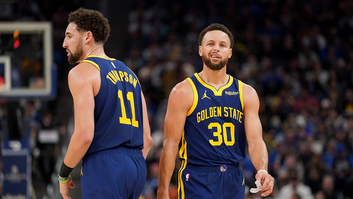 Dec 28, 2023; San Francisco, California, USA; Golden State Warriors guard Stephen Curry (30) stands next to guard Klay Thompson (11) after a play against the Miami Heat in the third quarter at the Chase Center. Mandatory Credit: Cary Edmondson-USA TODAY Sports