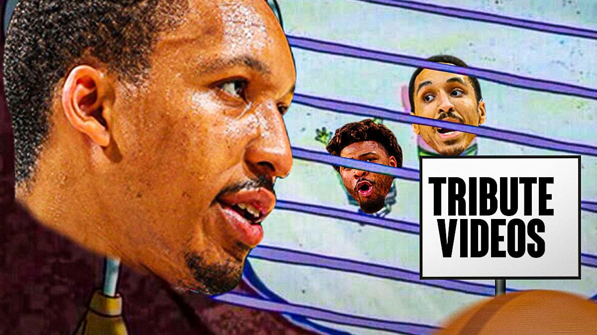 Grant Williams running around looking at Malcolm Brogdon and Marcus Smart tribute videos