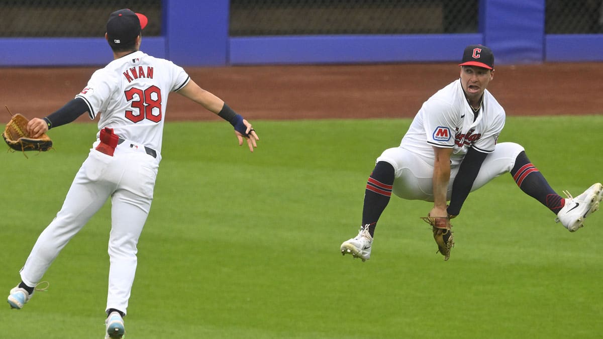 Cleveland Guardians left fielder Steven Kwan (38) and right fielder Will Brennan (17) celebrate after defeating the Toronto Blue Jays at Progressive Field