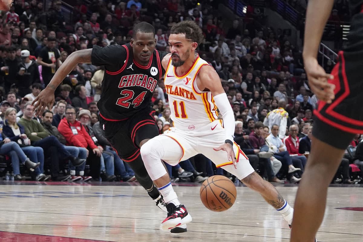 Chicago Bulls guard Javonte Green (24) defends Atlanta Hawks guard Trae Young (11) during the second half during a play-in game of the 2024 NBA playoffs at United Center.