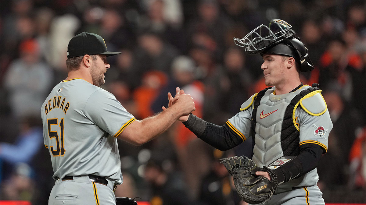Pittsburgh Pirates pitcher David Bednar (51) celebrates with catcher Henry Davis (right) after defeating the San Francisco Giants at Oracle Park.