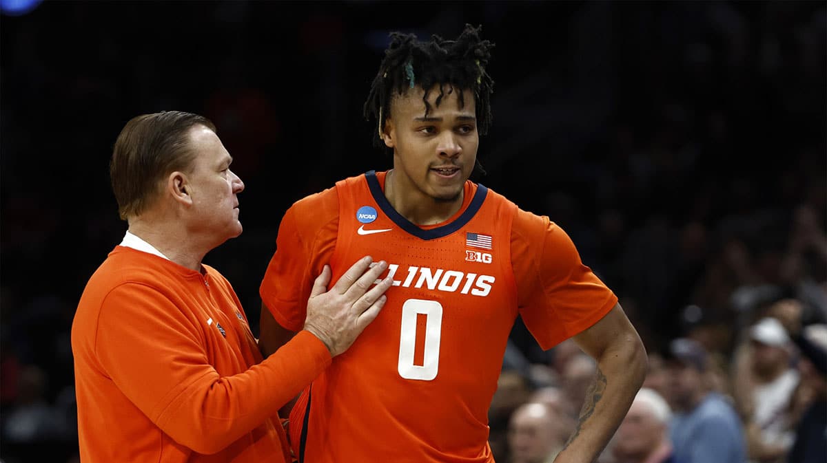 Illinois Fighting Illini head coach Brad Underwood reacts with guard Terrence Shannon Jr. (0) against the Connecticut Huskies in the finals of the East Regional of the 2024 NCAA Tournament at TD Garden.
