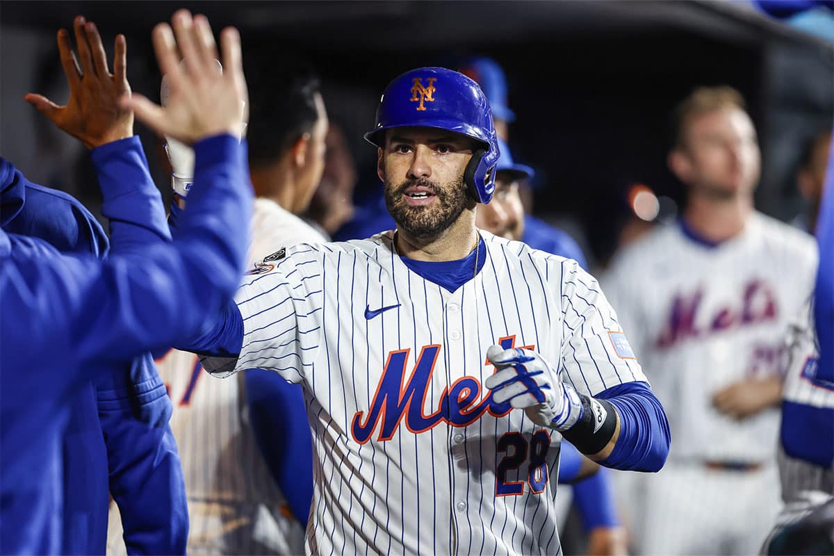 New York Mets designated hitter J.D. Martinez (28) celebrates with teammates in the dugout after hitting a solo home run in the eighth inning against the Arizona Diamondbacks at Citi Field