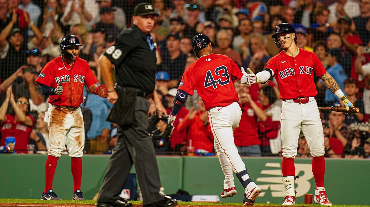 Boston Red Sox center fielder Ceddanne Rafaela (43) is congratulated after hitting a two run home run against the Detroit Tigers in the sixth inning at Fenway Park
