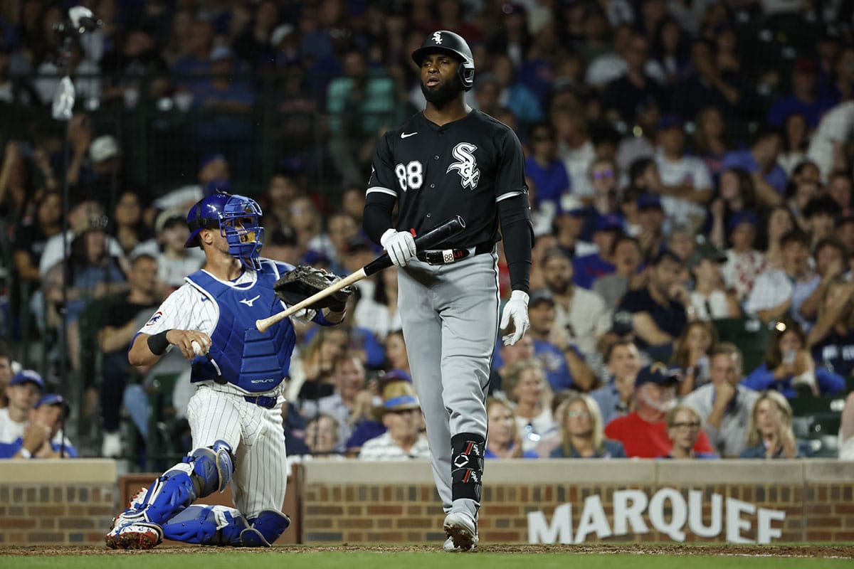 Chicago White Sox center fielder Luis Robert Jr. (88) reacts after striking out against the Chicago Cubs during the ninth inning at Wrigley Field