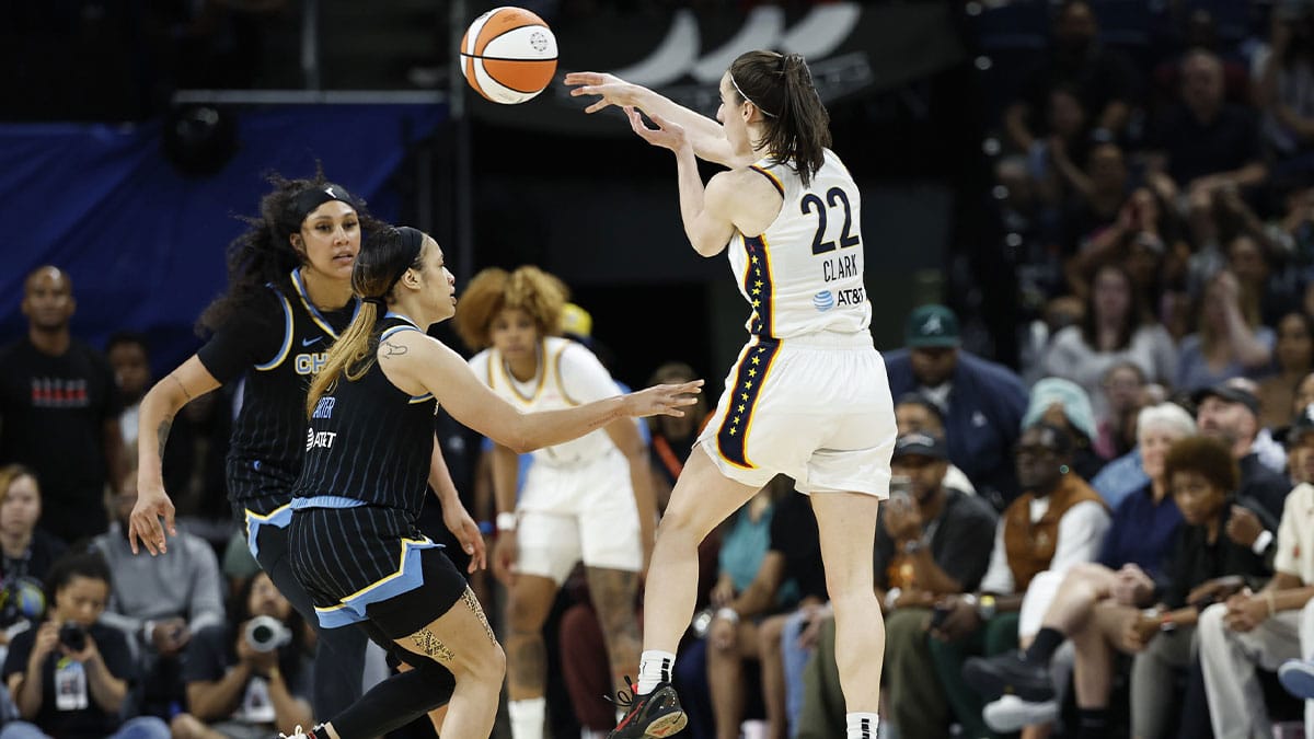 Indiana Fever guard Caitlin Clark (22) passes the ball against the Chicago Sky
