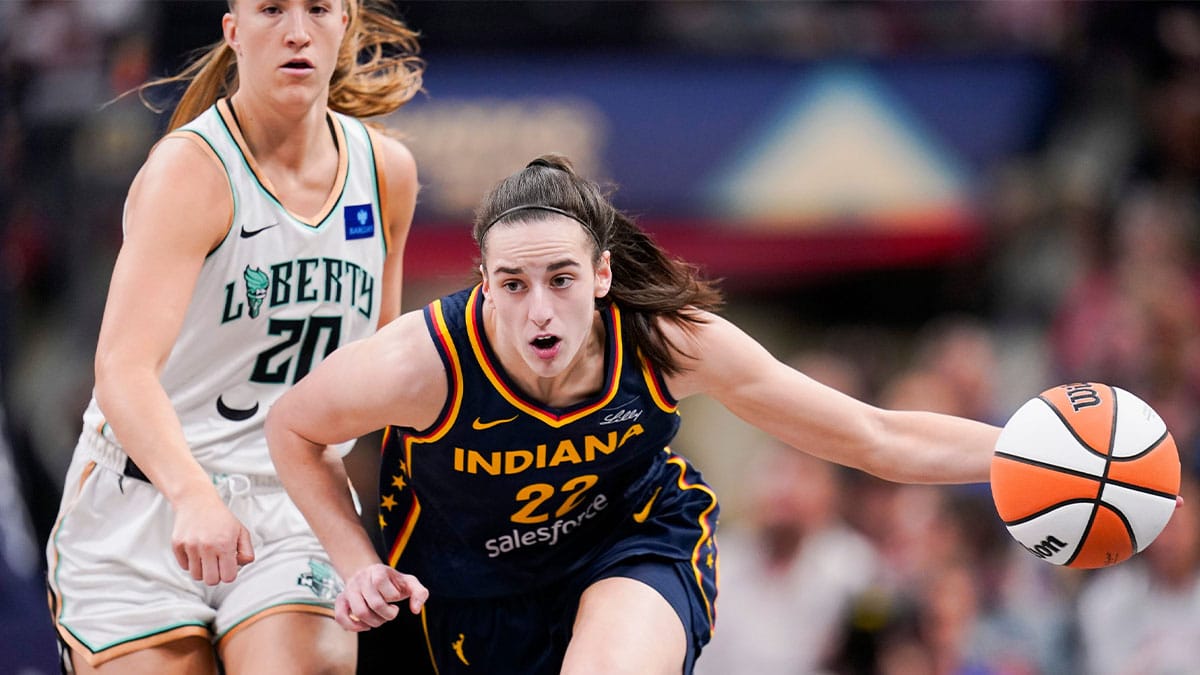 May 16, 2024; Indianapolis, IN, USA; Indiana Fever guard Caitlin Clark (22) rushes up the court past New York Liberty guard Sabrina Ionescu (20) on Thursday, May 16, 2024, during the Indiana Fever home opener game against the New York Liberty at Gainbridge Fieldhouse in Indianapolis. Mandatory Credit: Grace Hollars-USA TODAY Sports