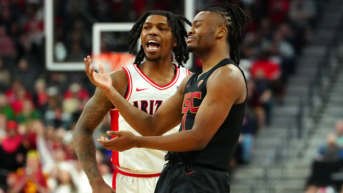 Southern California Trojans guard Isaiah Collier (1) and Arizona Wildcats guard Caleb Love (2) react to a non-call during the first half at T-Mobile Arena. 