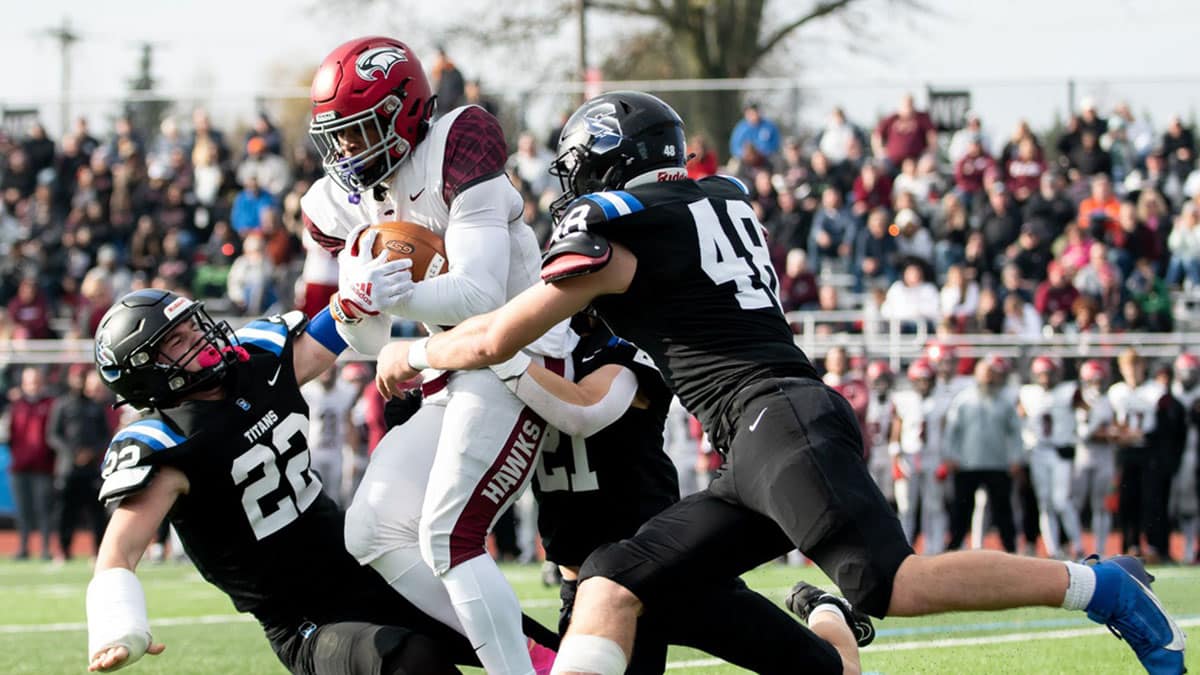 Central Bucks South linebackers, Jim Wade, left, John Henson, back, and Sean Moskowitz, right, take down St. Joseph's Prep running back Isaiah West in a PIAA Class 6A state semifinal football game, on Saturday, December 2, 2023, at North Penn High School in Towamencin.