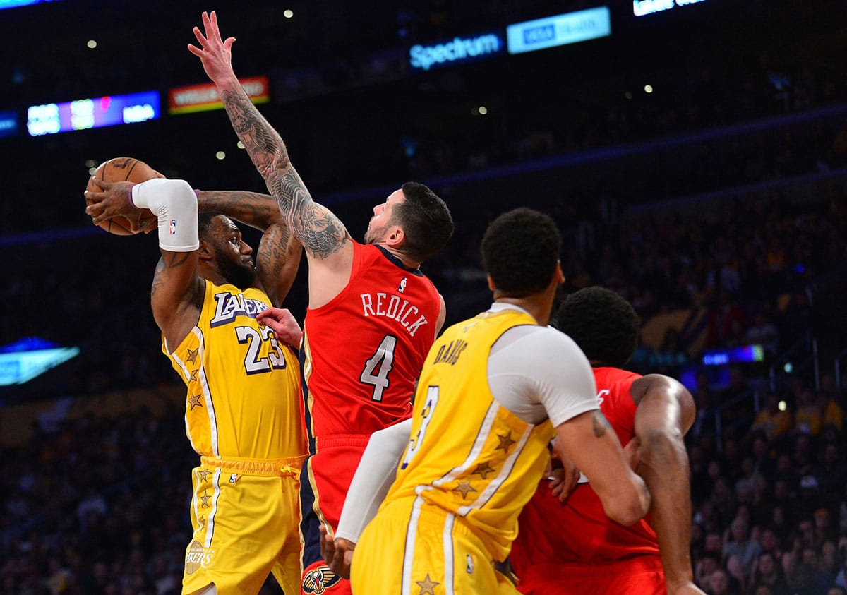 JJ Redick guarding Los Angeles Lakers' LeBron James