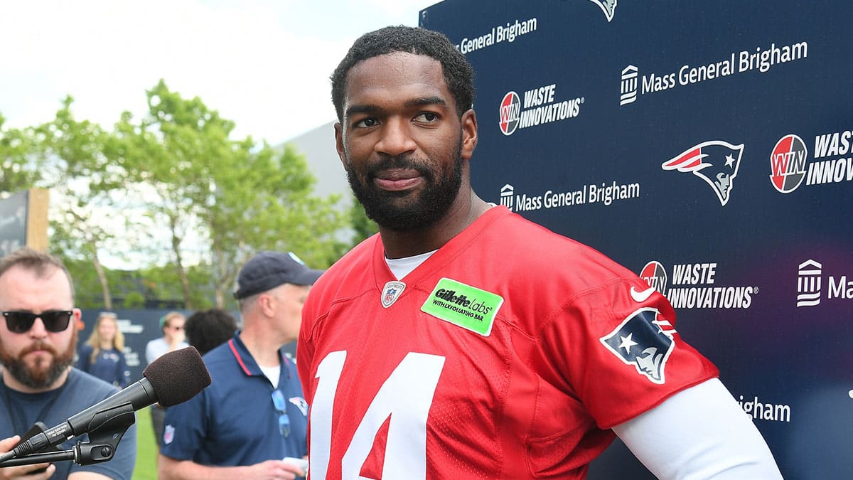 Jun 10, 2024; Foxborough, MA, USA; New England Patriots quarterback Jacoby Brissett (14) holds a press conference after minicamp at Gillette Stadium. Mandatory Credit: Eric Canha-USA TODAY Sports