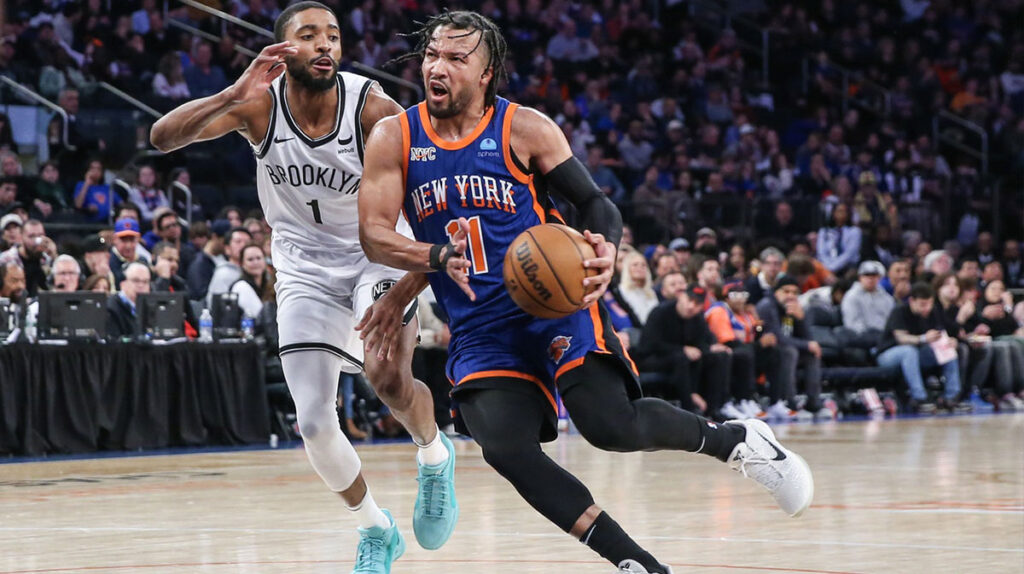 New York Knicks guard Jalen Brunson (11) drives past Brooklyn Nets forward Mikal Bridges (1) in the third quarter at Madison Square Garden. 
