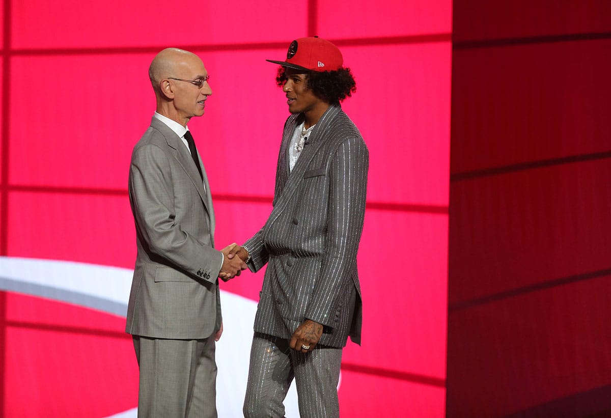 Jalen Green (G League Ignite) poses with NBA commissioner Adam Silver after being selected as the number two overall pick by the Houston Rockets in the first round of the 2021 NBA Draft at Barclays Center. 